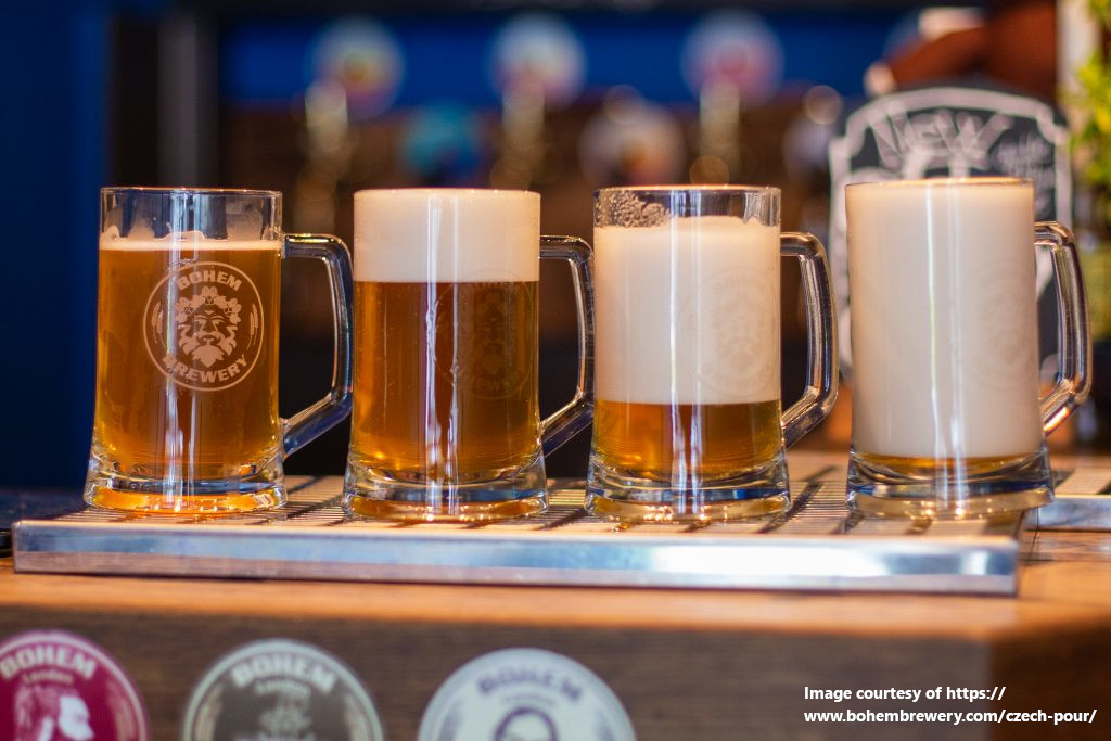 4 beer mugs with side pour methods showing different levels of foam typical from Czech pours
